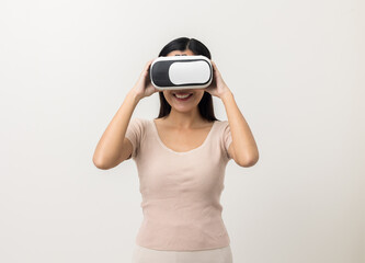 Young asian woman put on vr glasses into virtual simulated world. Future technology cyber universe. Enjoying an Experiences of Virtual World. Attractive asian woman on isolated white background
