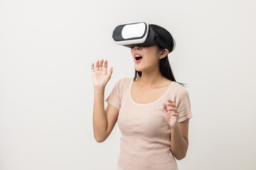 Young asian woman put on vr glasses into virtual simulated world. Future technology cyber universe. Enjoying an Experiences of Virtual World. Attractive asian woman on isolated white background