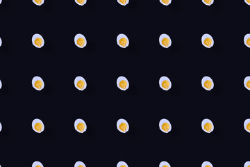 Colorful pattern of chicken eggs on black background. Top view. Flat lay. Pop art design. Seamless pattern