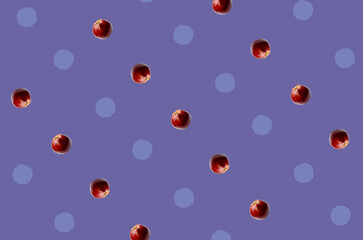 Colorful fruit pattern of fresh red apples on violet background. Top view. Flat lay. Pop art design, creative summer concept