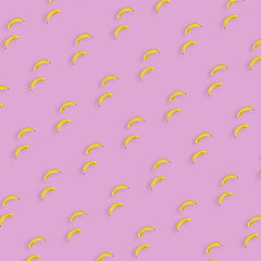 Fototapeta na wymiar Colorful fruit pattern of yellow bananas on pink background. Top view. Flat lay. Pop art design