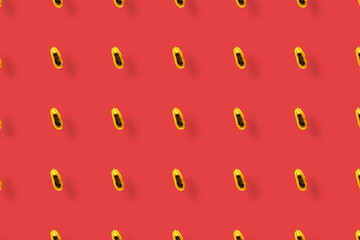 Colorful fruit pattern of fresh papaya on red background with shadows. Top view. Flat lay. Pop art design