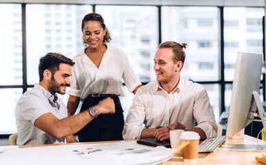 Group of business meeting and discussing strategy with startup project analysis finance process.Success business people plan and brainstorm marketing idea with laptop computer in office.Teamwork