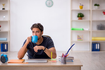 Young male designer working in the office
