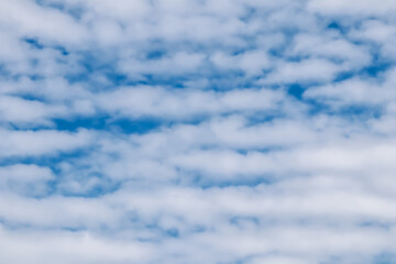 Obraz premium Background of blue sky with white clouds