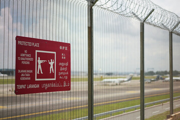 warning signage at airport telling people to keep away