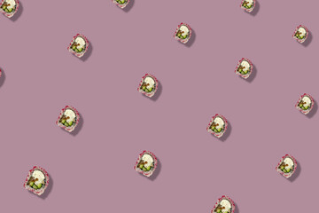Colorful pattern of japanese sushi rolls on pastel pink background. Top view. Flat lay. Pop art design