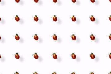 Colorful pattern of fresh red tomatoes on white background with shadow. Top view. Flat lay. Pop art design