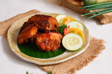 a plate of chicken roasted with vegetables 