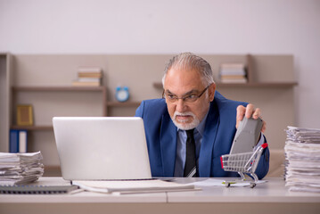 Old male boss working from home during pandemic