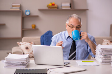 Old male boss working from home during pandemic