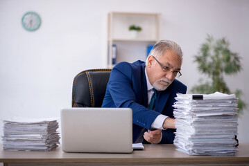 Old male employee and too much work in the office