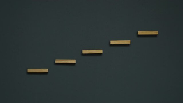wooden step increase on blackboard.