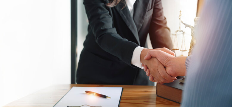 Legal and businessman advisor handshake for teamwork, talking, planning analyze investment and marketing at office.