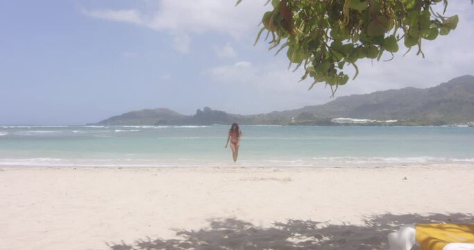 Latino Girl Model Exits the Warm Tropical Ocean at Playa Teco Maimon Beach Resort Dominican Republic, Wide Shot