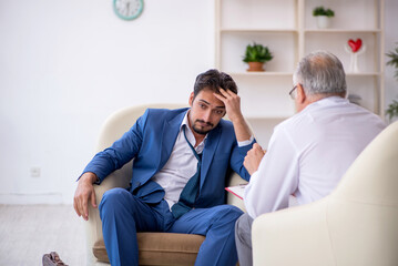 Young businessman employee visiting psychologist