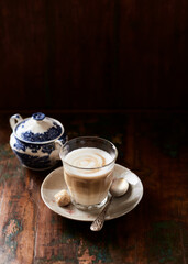 Coffee with milk on dark background. Soft focus. Copy space.