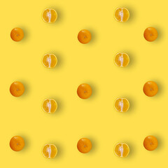 Colorful fruit pattern of fresh orange on yellow background with shadows. Top view. Flat lay. Pop art design