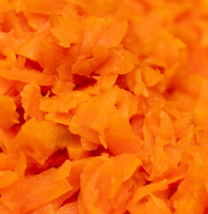 Orange boiled carrots as a background.
