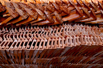 Stack of Red roof tiles for a Buddhist Temple restoration at Thailand.