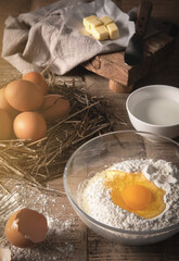 Preparing to Make Bread Using Flour and Eggs