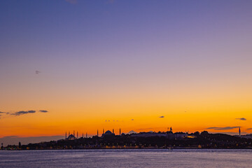Fototapeta na wymiar Istanbul sunset. Cityscape of Istanbul at sunset with golden sky