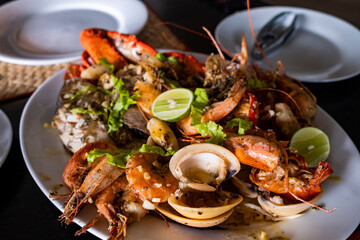 seafood platter on table with limes