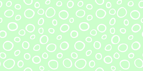 Spotty abstract vector seamless pattern. Random rings, dots, circles, spots, stains, bubbles, stones. Design for fabric, funny cute print. Irregular random texture. Repetitive graphic background