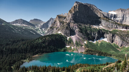 Fototapeta na wymiar Glacier national park mountains and blue-green lakes