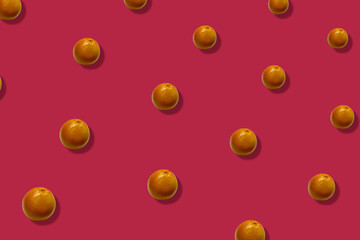 Colorful fruit pattern of fresh grapefruits on pink background with shadows. Top view. Flat lay. Pop art design