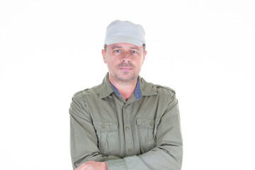 cheerful bearded man military cap arms crossed on white background