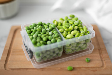 frozen green peas and beans in a plastic container