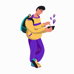 A young man with a backpack uses a smartphone.