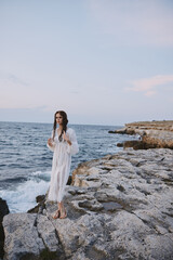 Fototapeta na wymiar woman traveler white dress standing outdoor relax unaltered