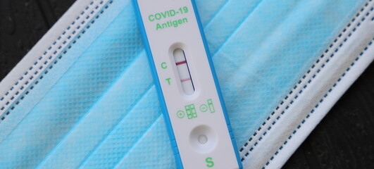 a positive corona antigen test on a mask 
