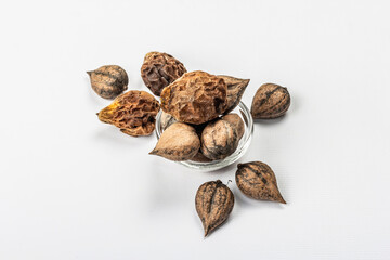 Ripe Juglans cordiformis Maxim or heart-shaped walnut isolated on white background