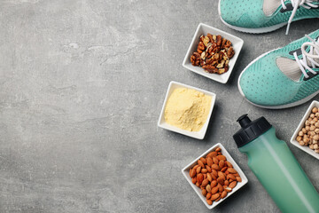 Concept of sports nutrition on gray textured background