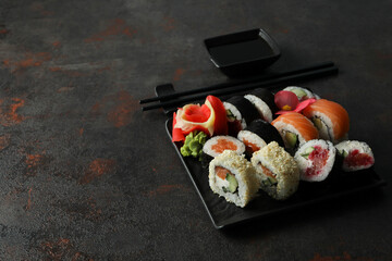 Concept of tasty food with sushi rolls, space for text
