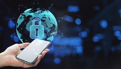 Close up of hand holding smartphone with abstract glowing globe hologram with security padlock icon...