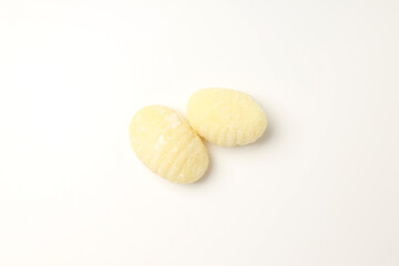 Raw potato gnocchi on white background, close up