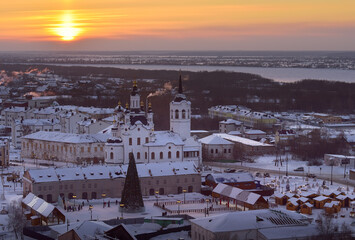 Fototapeta premium Winter sunset over the lower city. The bank of the Irtysh, the Church of Zacharias