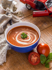 tomato soup in a bowl on table