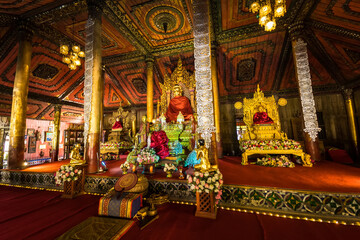Fototapeta na wymiar Phayao, Thailand - January, 09, 2022 : Myanmar Buddha Statue in Church of Wat Nantaram or Nantaram Temple at Phayao Thailand.