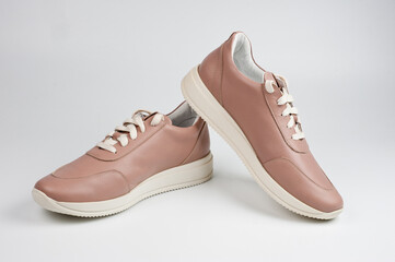 Light brown faux leather shoes with laces. Close-up shot.