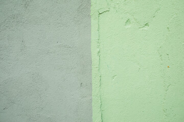 Gray and green bicolored plasters textured wall, background, wallpaper.