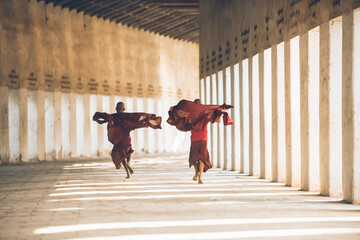  Children monks spending time together. In myanmar childrens start the training to become monks at the age of seven - obrazy, fototapety, plakaty