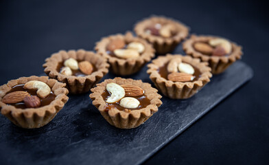 Close-up of cookies in the form of baskets with nut filling.