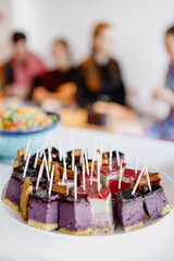 Colorful Raw vegan dessert served for party as canape tarts with toothpicks
