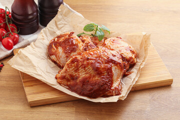 Marinated chicken leg in tomato sauce