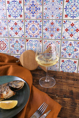 Grilled fish and wine on a wooden table